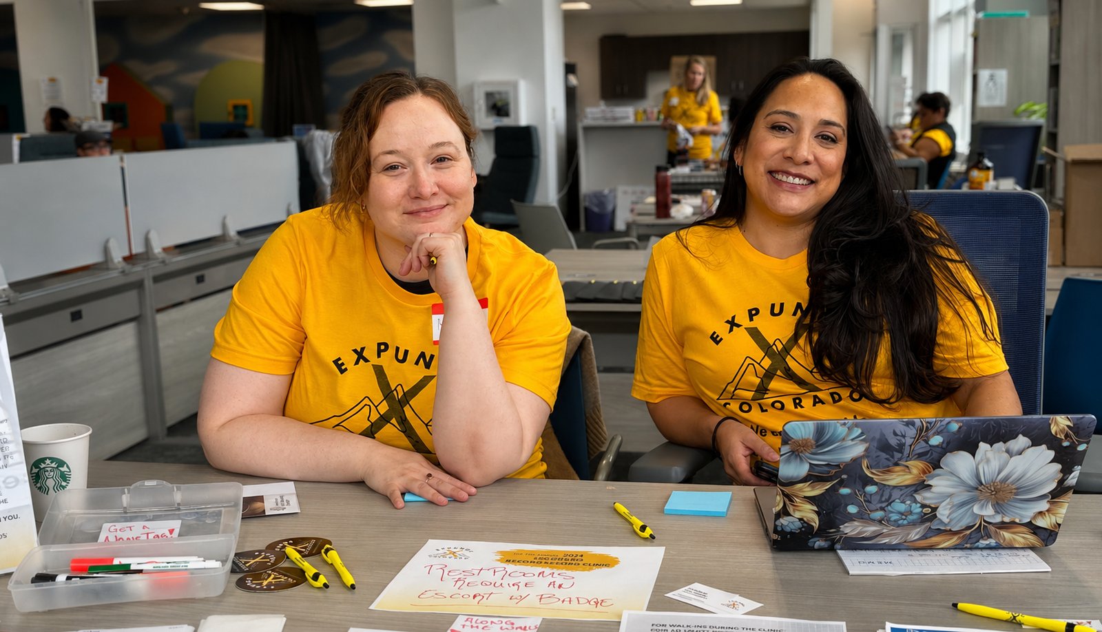Volunteers welcoming attendees at an Expunge Colorado clinic